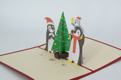 Penguins Decorating Xmas tree